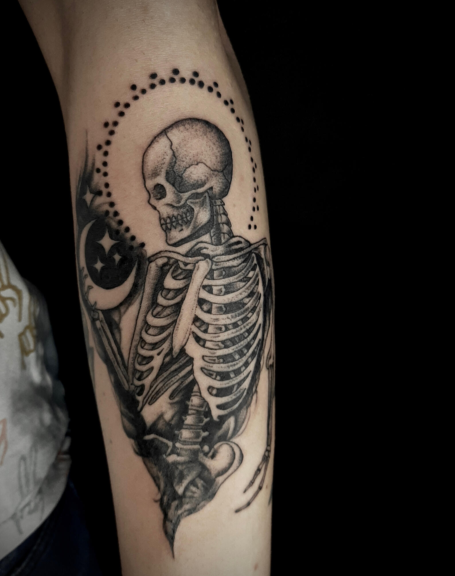 Skull and moon fineline tattoo